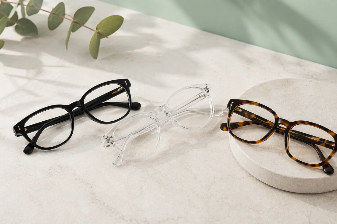 Black, clear, and tortoiseshell optical frames arranged side by side