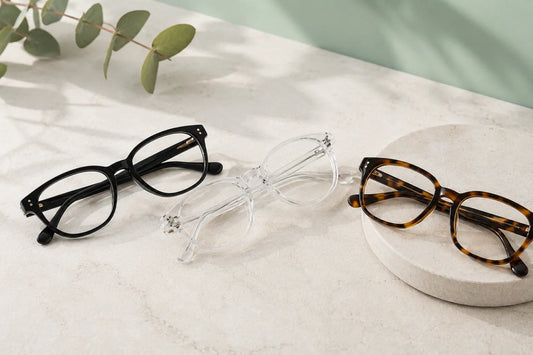 Black, clear, and tortoiseshell optical frames arranged side by side